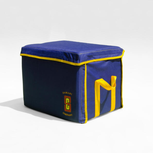 Navy blue Samani Company storage bag with yellow trim and logo design. - cropped white border