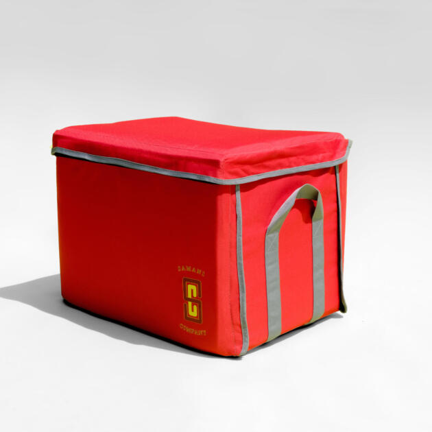 Red Samani Company storage bag with gray trim and logo design. - cropped white border